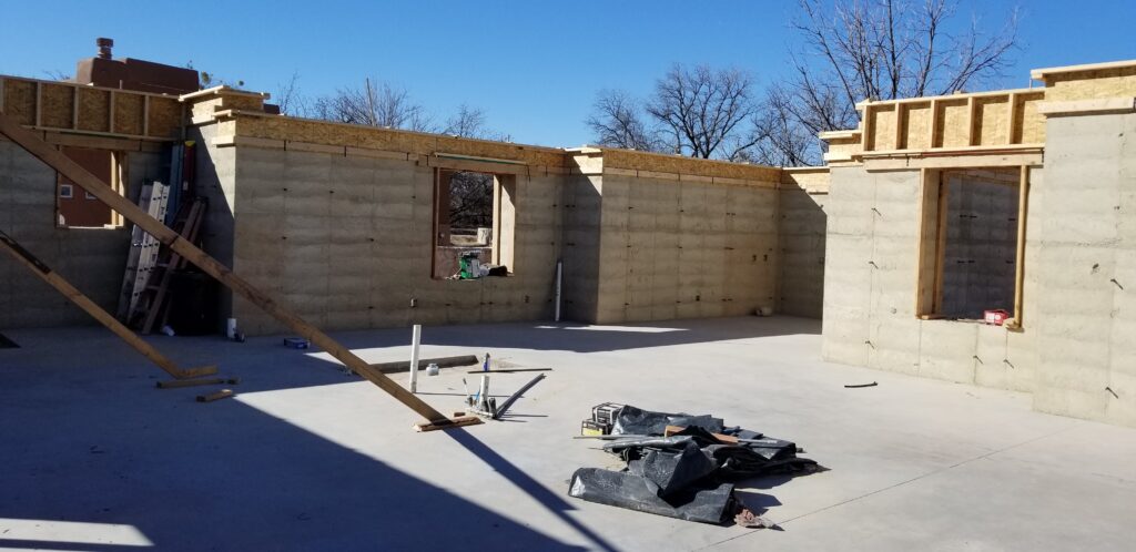 A rammed earth home in the middle of construction