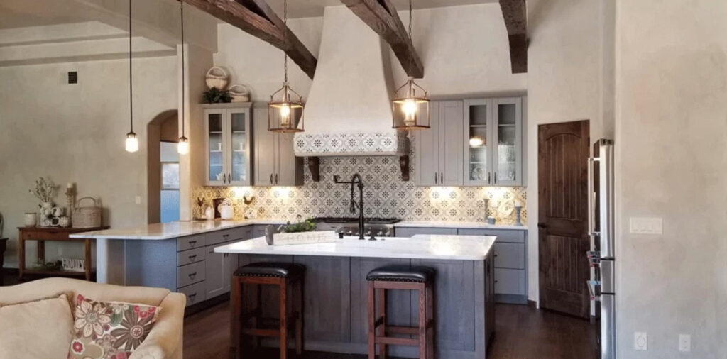 A recently-completed kitchen remodeling project featuring gorgeous tile backdrops and mullioned glass cabinet doors.