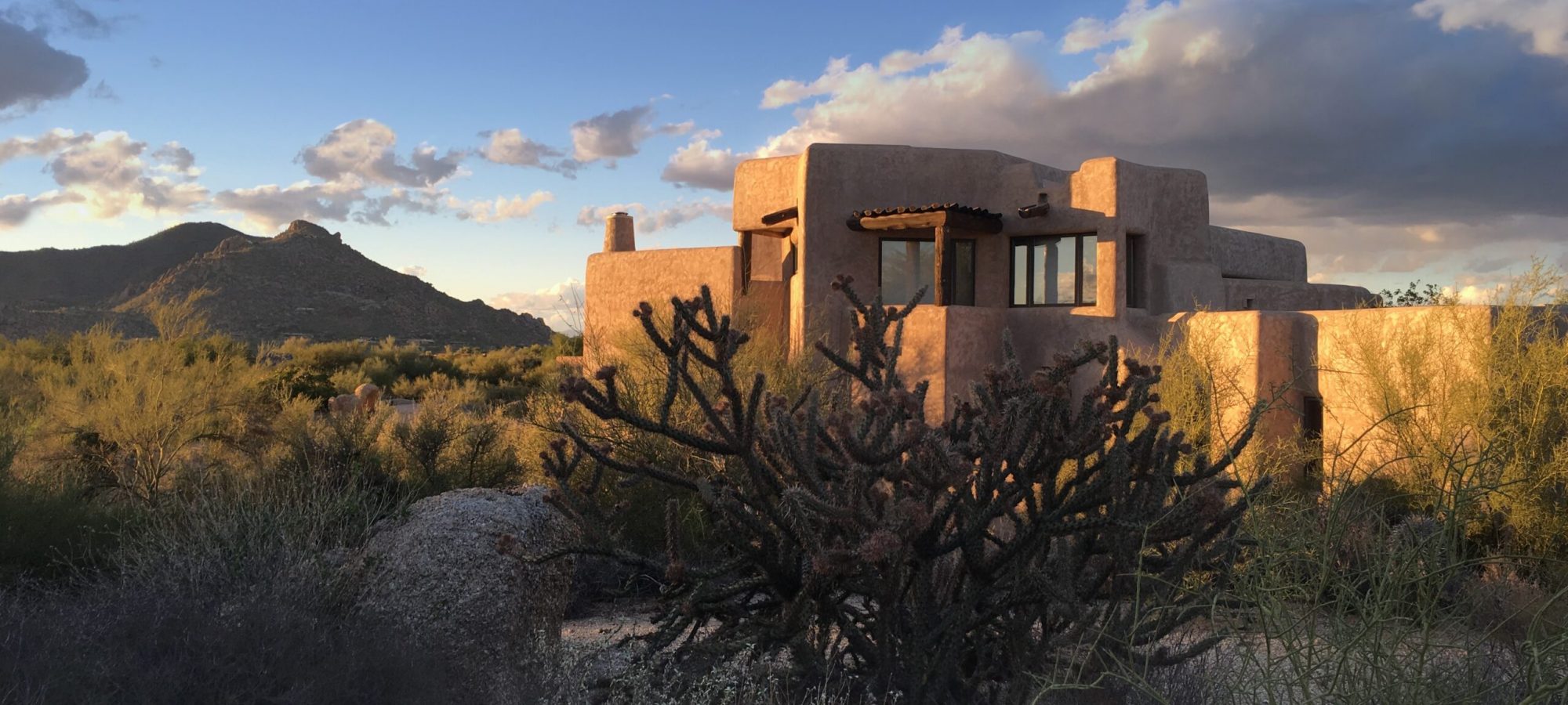 a rammed earth home in the desert